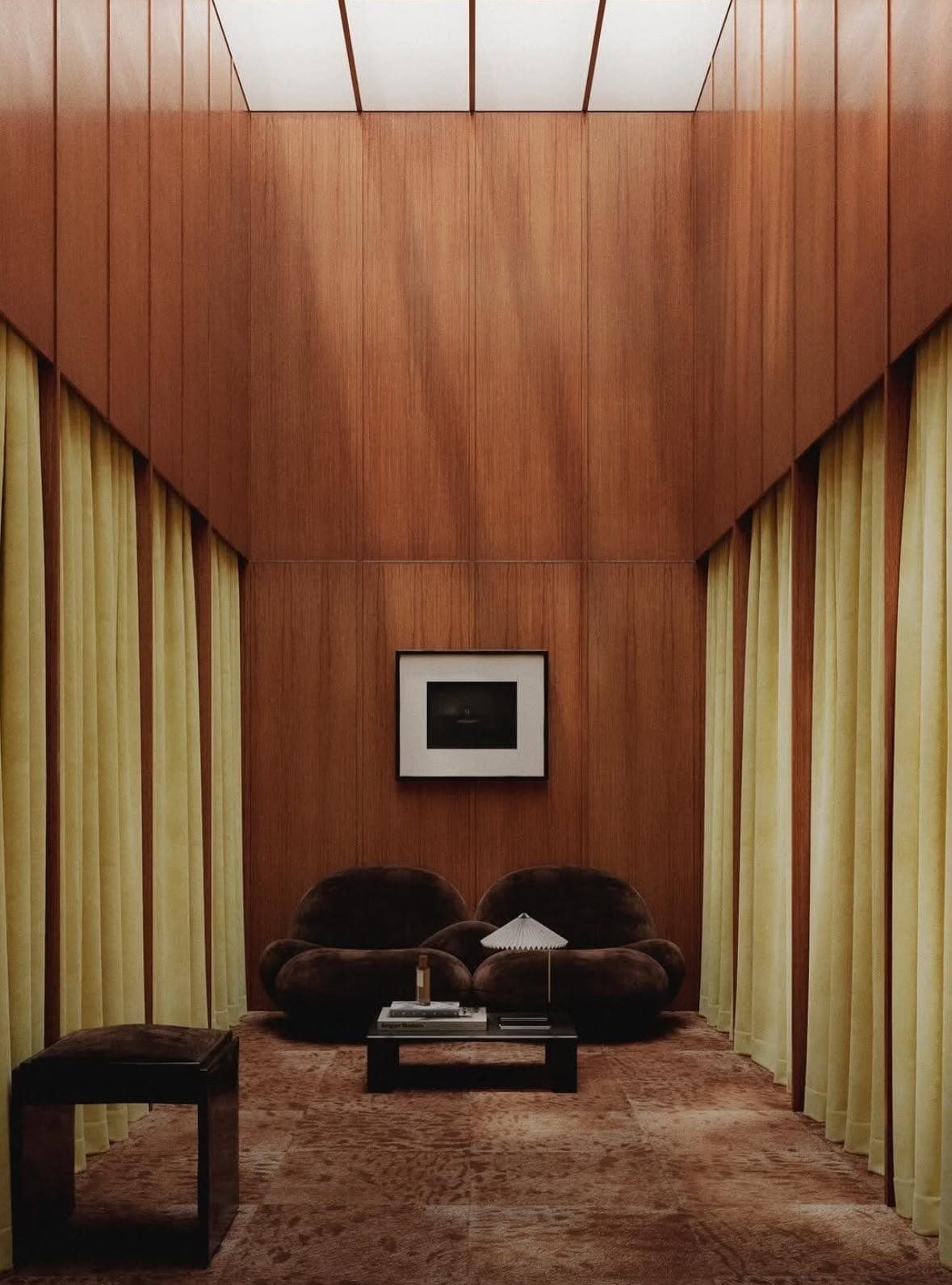 Tall wood-panelled space lined with pale yellow curtains and a skylight