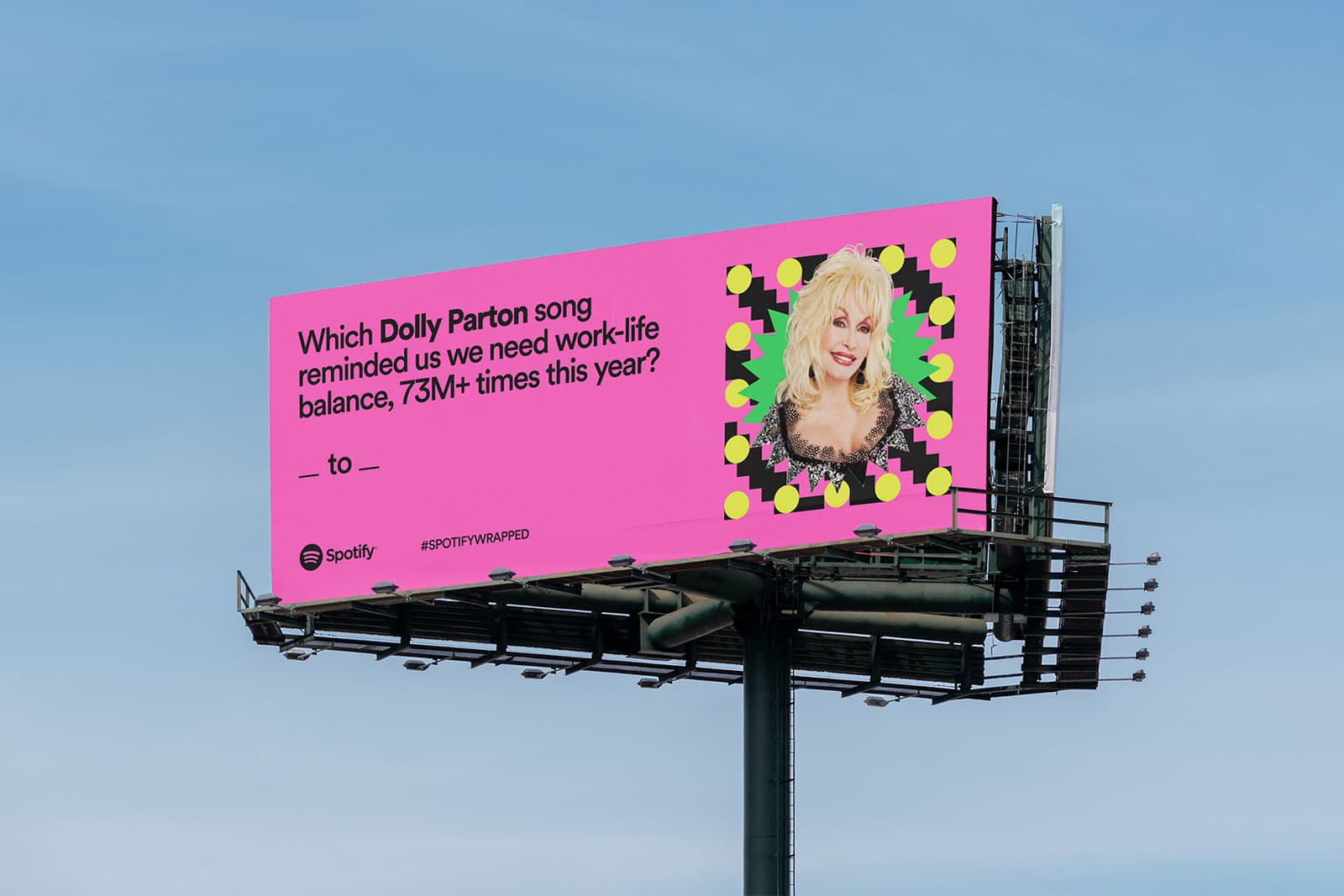 Pink Spotify Wrapped billboard asking which Dolly Parton song reminded us we need work-life balance